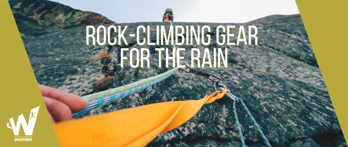 Perspective is looking up a rock face with ropes and straps and carabiners in view.